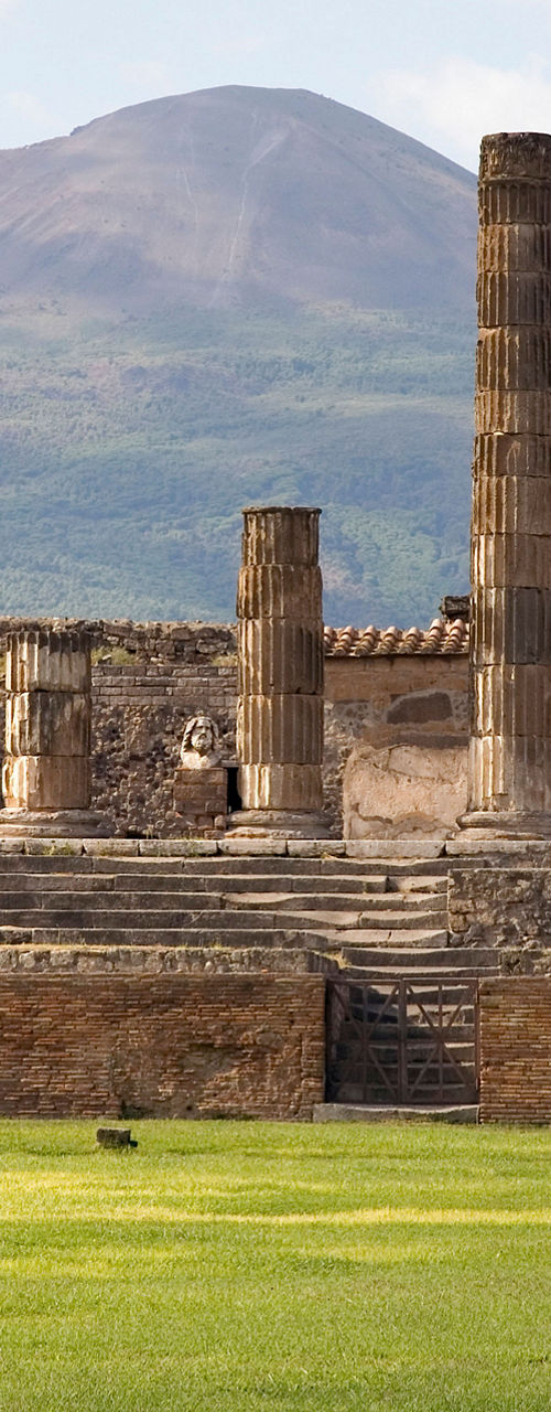 Ancient ruins with Mount Vesuvius backdrop