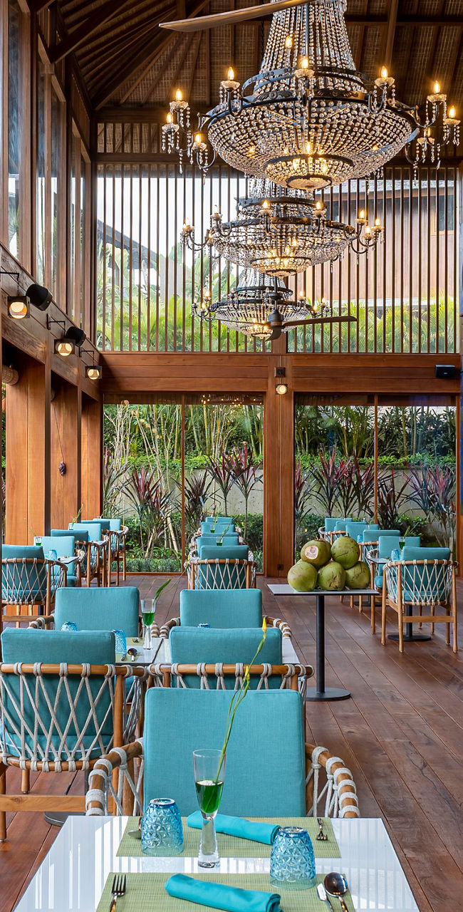 Open-air tropical restaurant with wooden decor