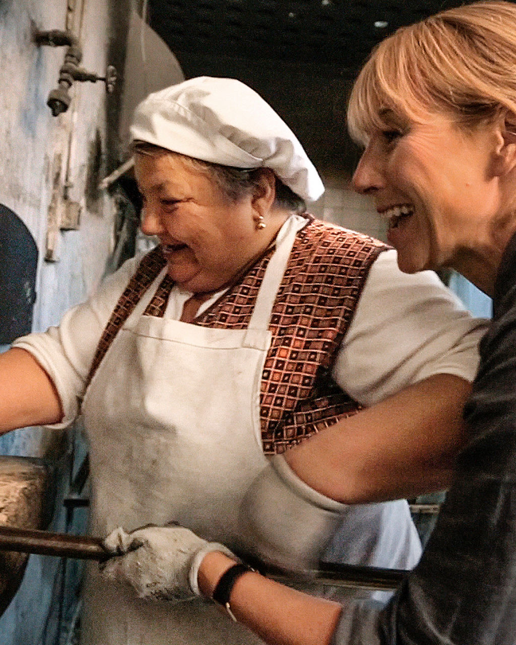 Traditional bread baking in rustic oven