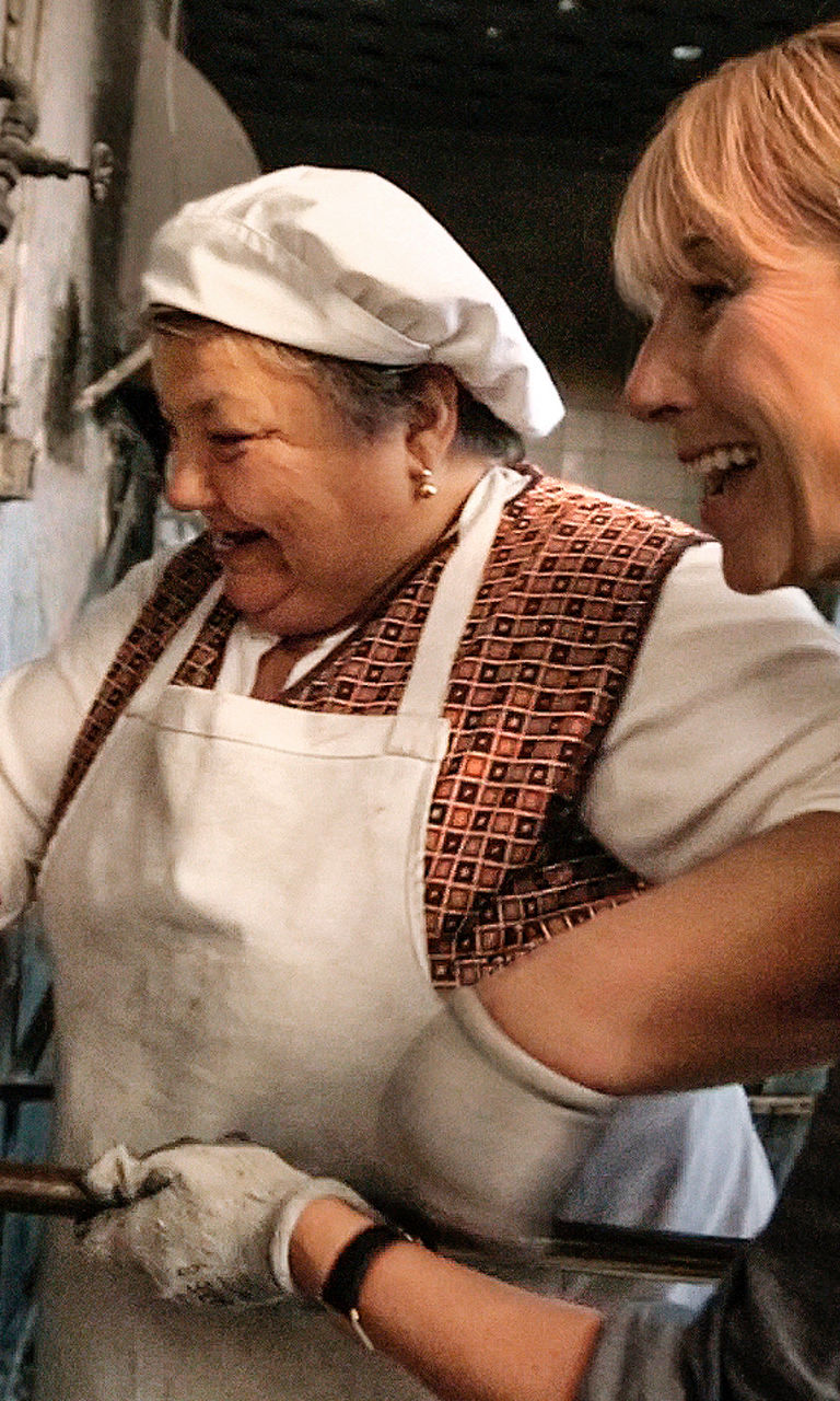 Traditional bread baking in rustic oven
