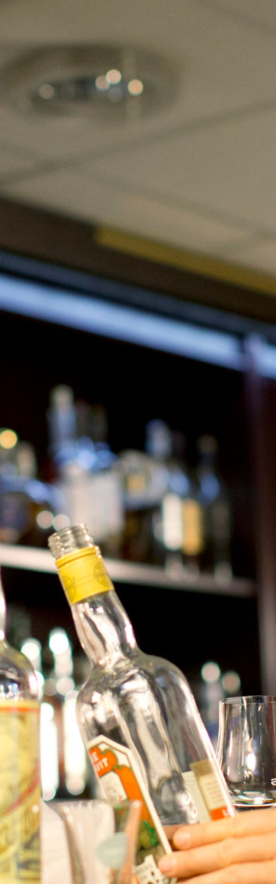 Bar setting with whiskey bottles displayed