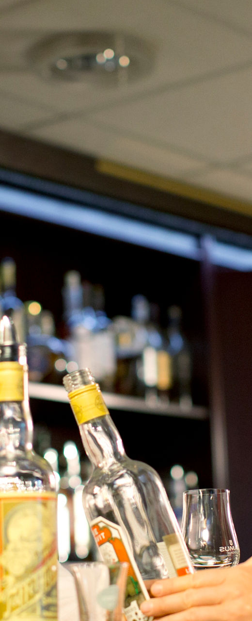 Bar setting with whiskey bottles displayed
