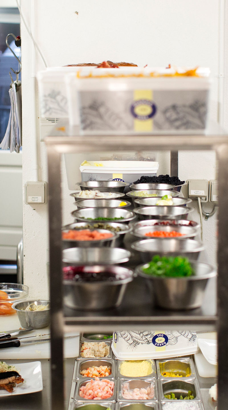 Professional kitchen with chefs preparing meals