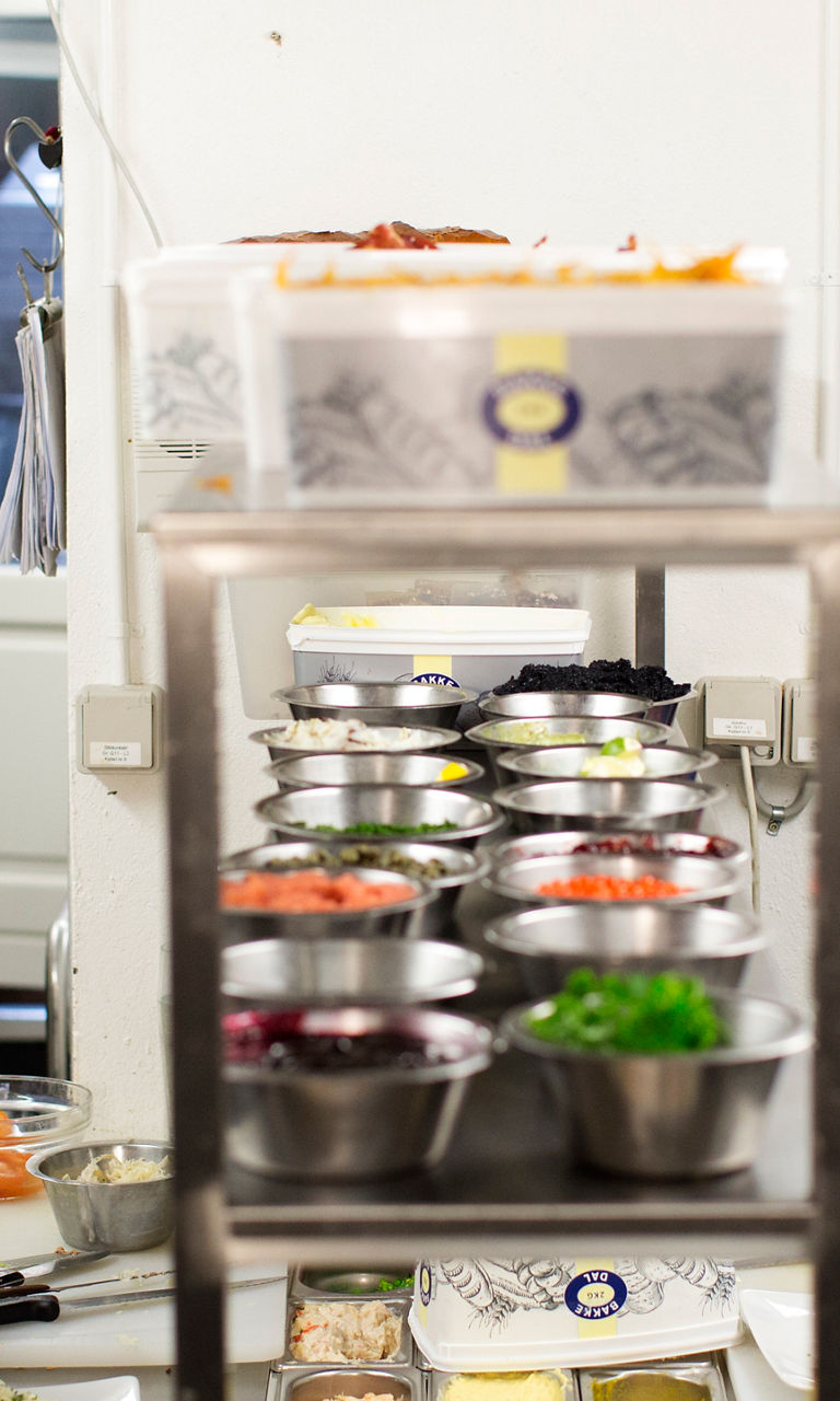 Professional kitchen with chefs preparing meals