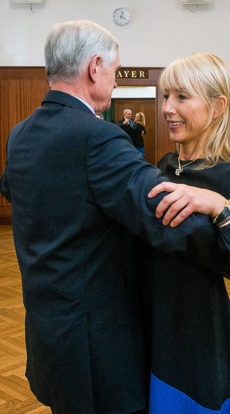 Couples dancing in elegant ballroom setting