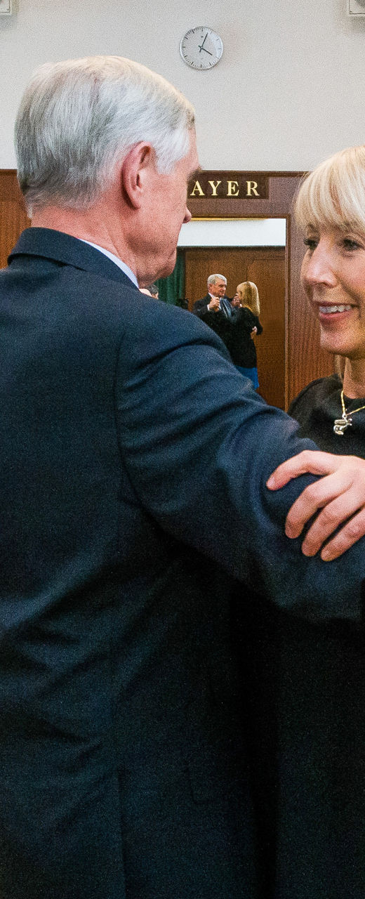 Couples dancing in elegant ballroom setting