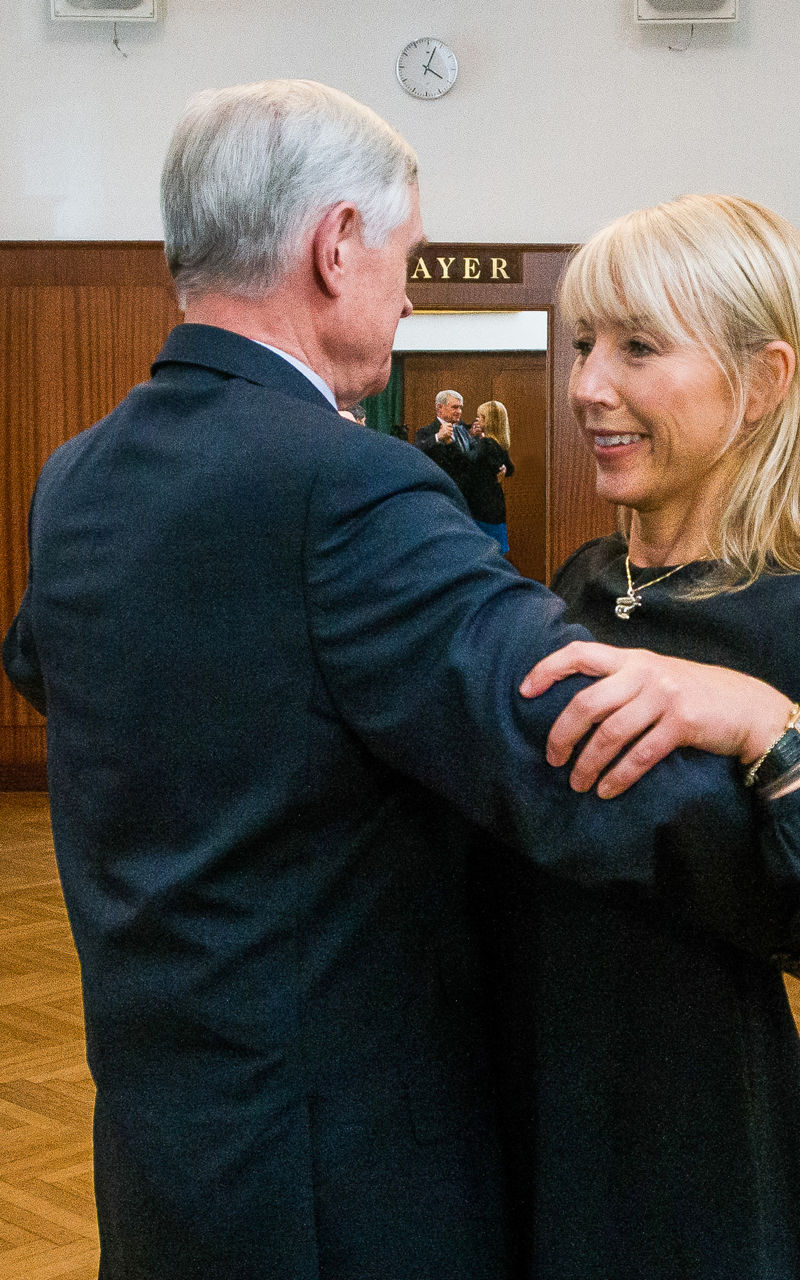 Couples dancing in elegant ballroom setting