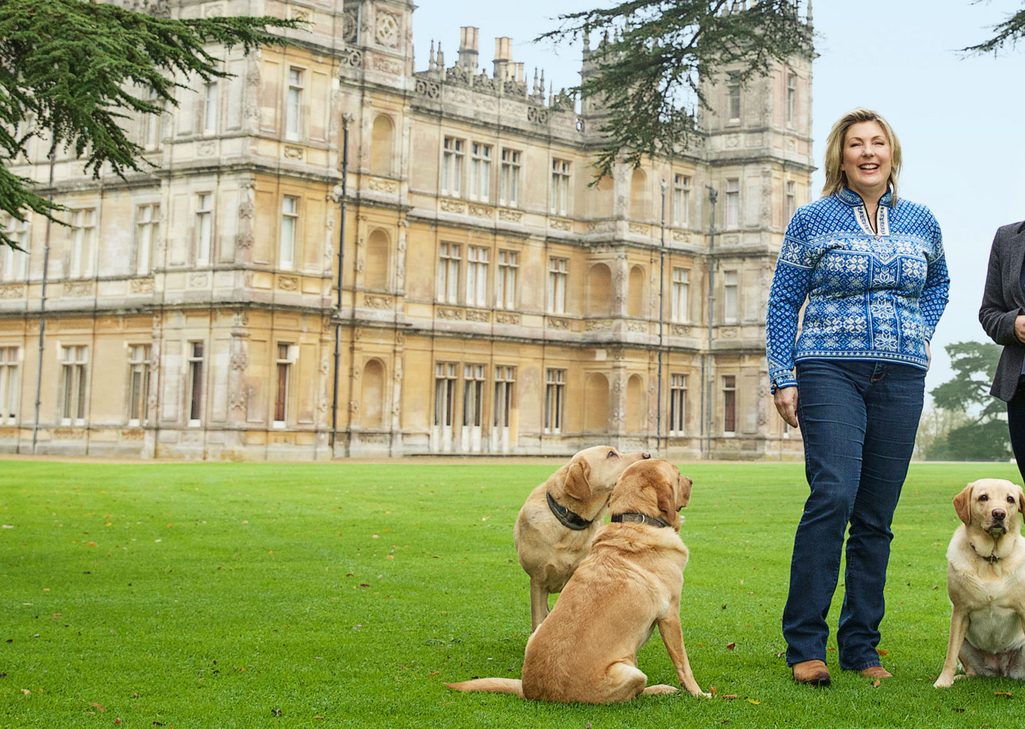 Two women with dogs at historic estate