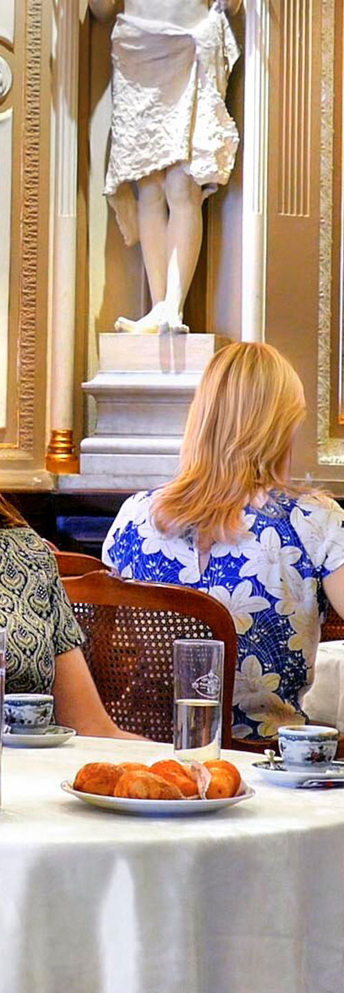 Elegant café gathering in ornate setting