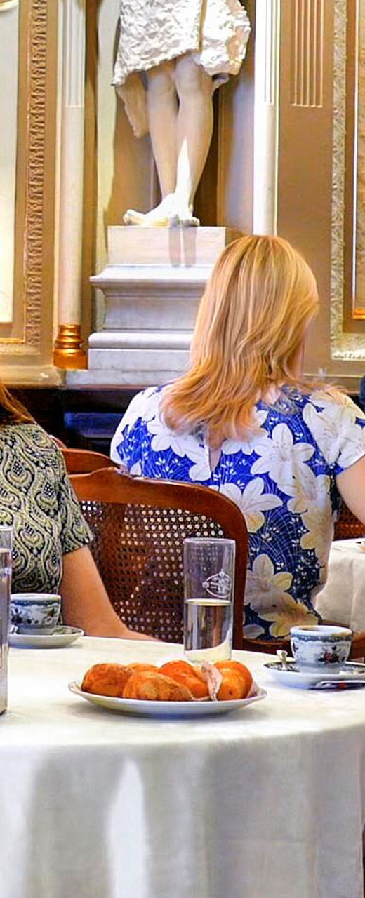 Elegant café gathering in ornate setting
