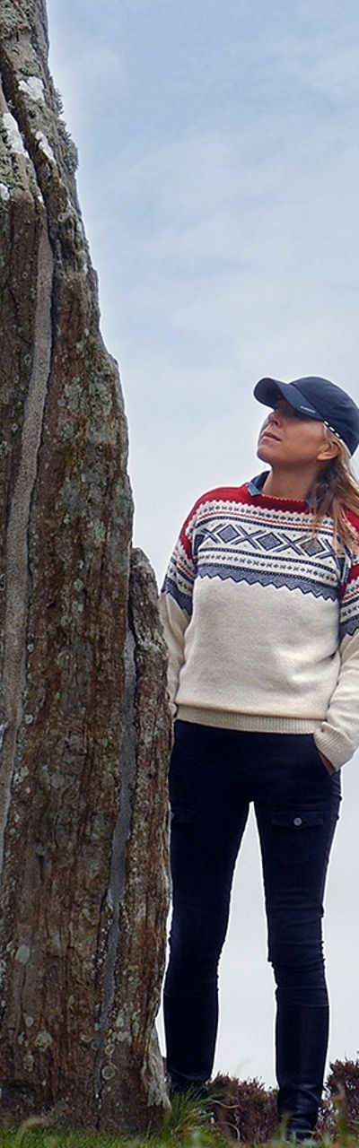 Woman exploring ancient stone circle outdoors