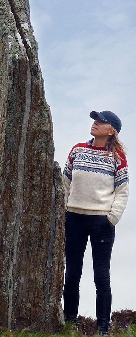Woman exploring ancient stone circle outdoors