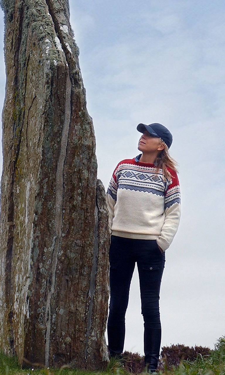Woman exploring ancient stone circle outdoors