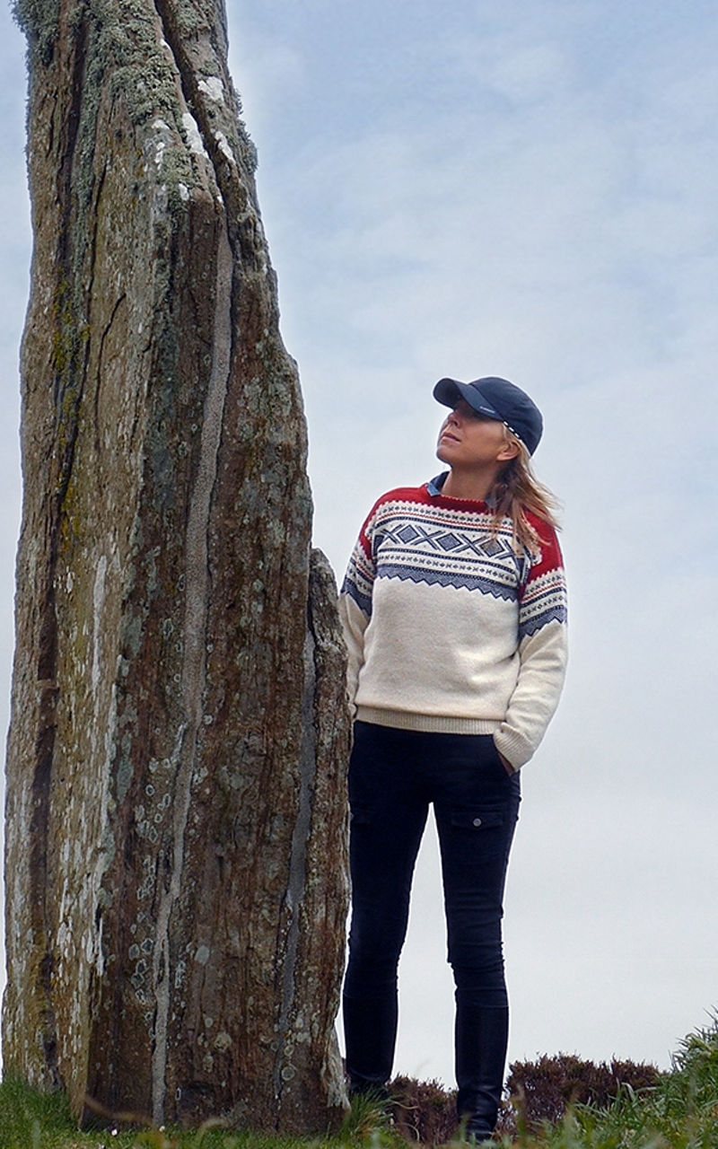 Woman exploring ancient stone circle outdoors