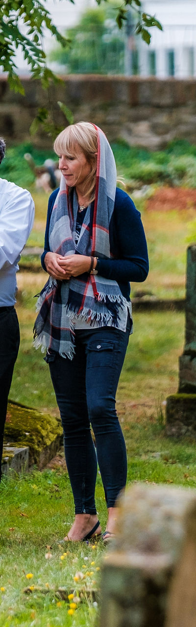 Two people walking in a cemetery
