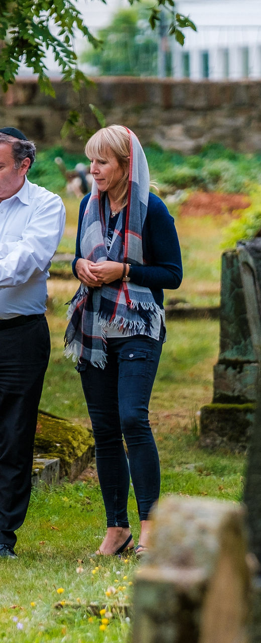 Two people walking in a cemetery
