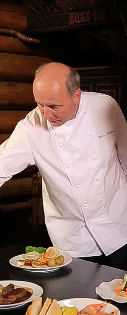 Chef presenting dishes in rustic setting