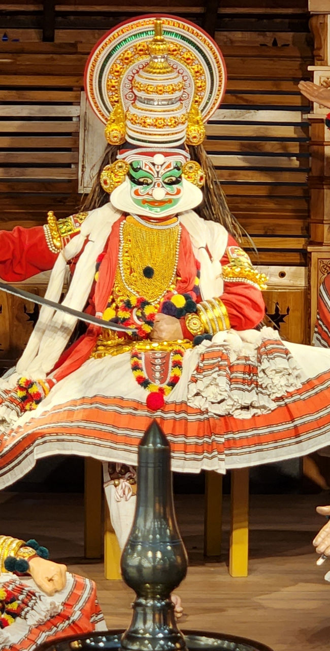 Traditional Kathakali dancers in vibrant costumes