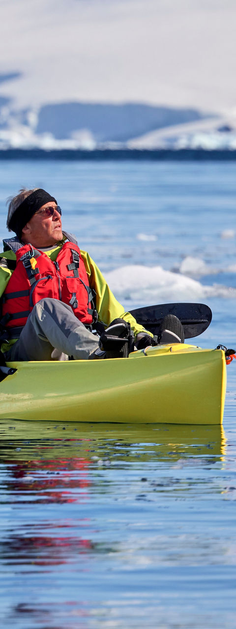 Two kayakers in icy Antarctic waters