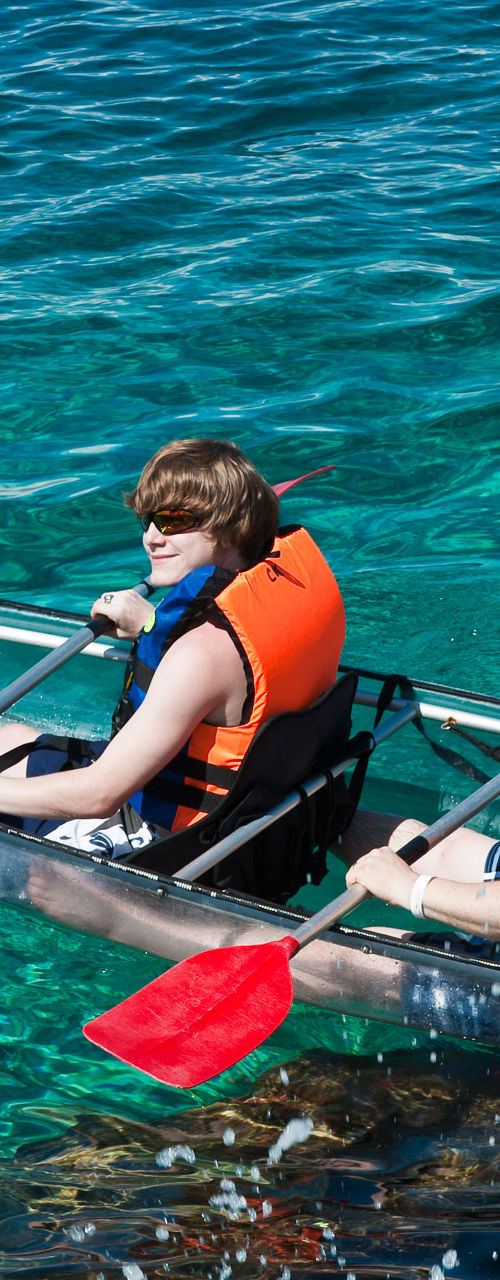 Two people kayaking in clear waters