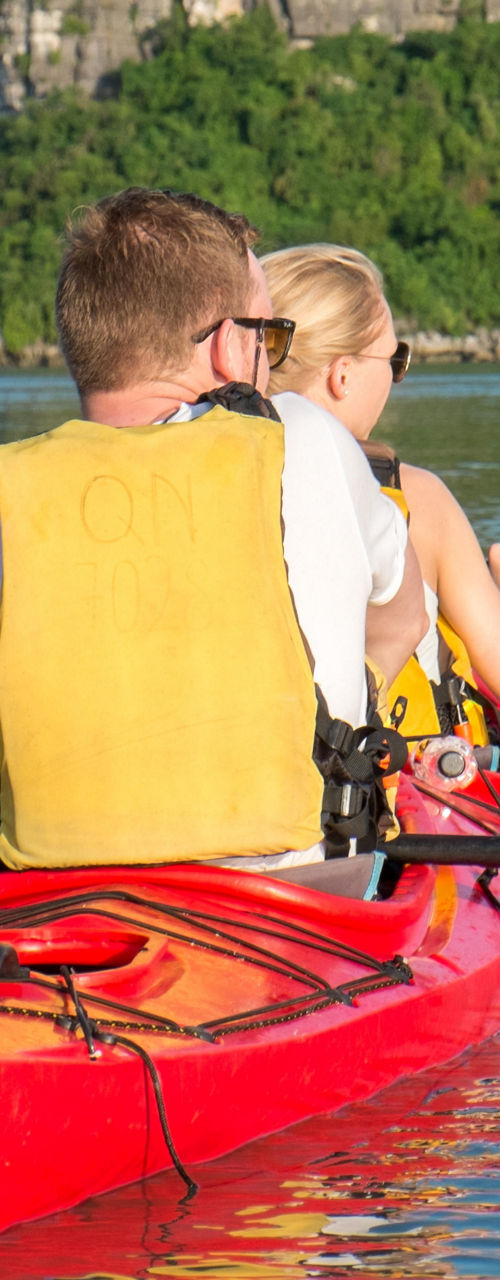 Couple kayaking in scenic tropical waters