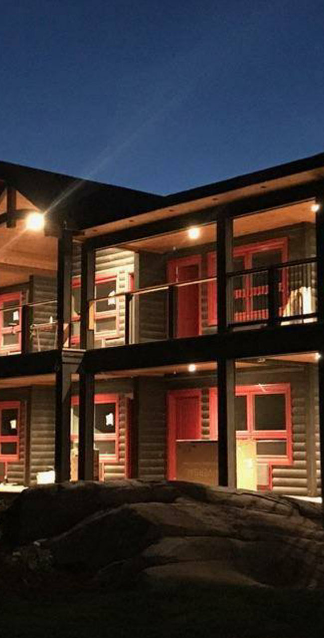 Modern lodge illuminated at night