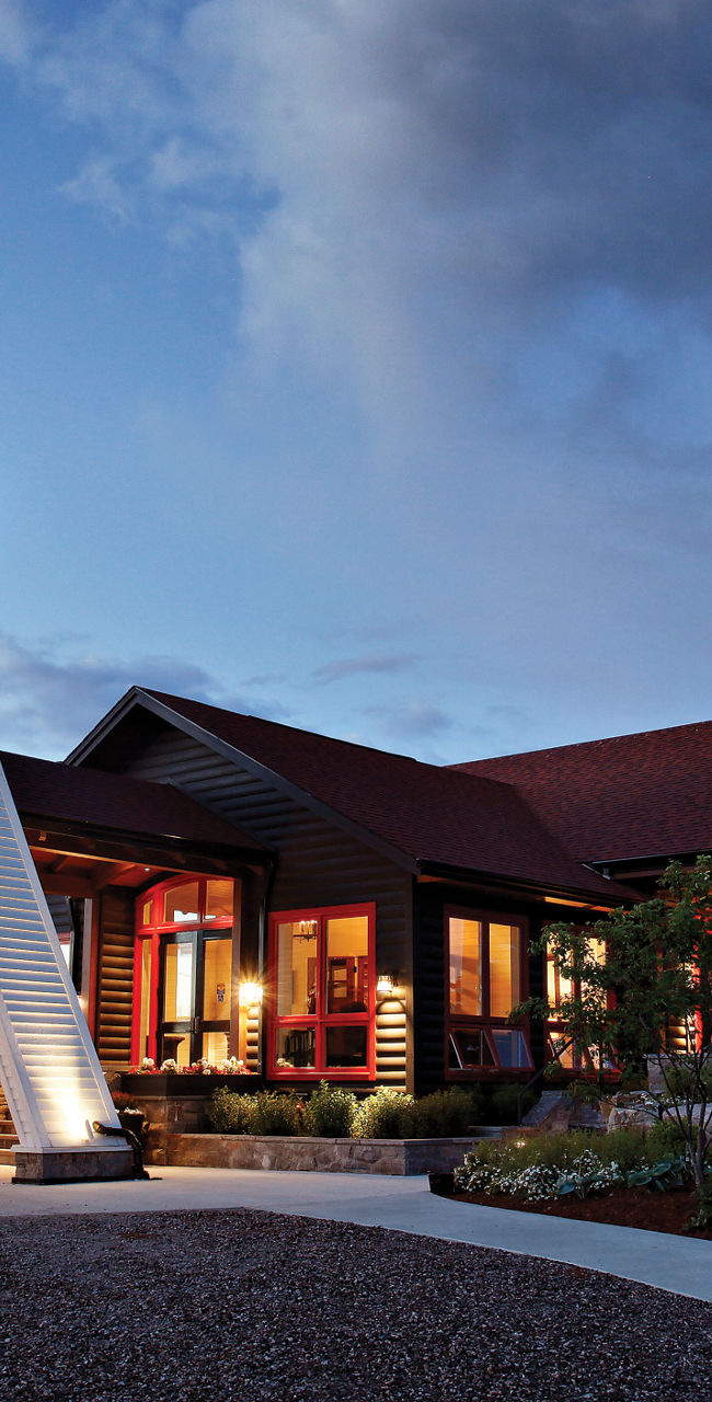 Lighthouse-inspired building at dusk