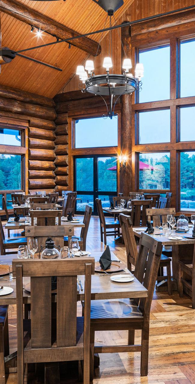 Rustic log cabin dining room with fireplace