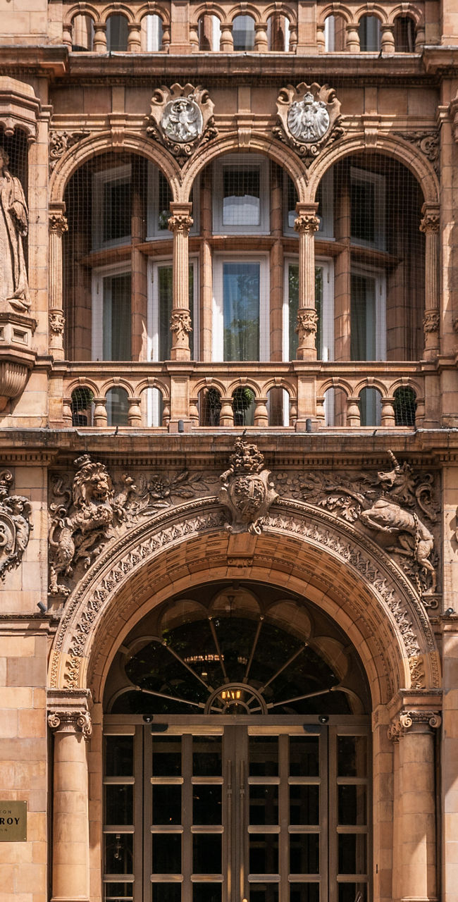 Historic luxury hotel facade with flags