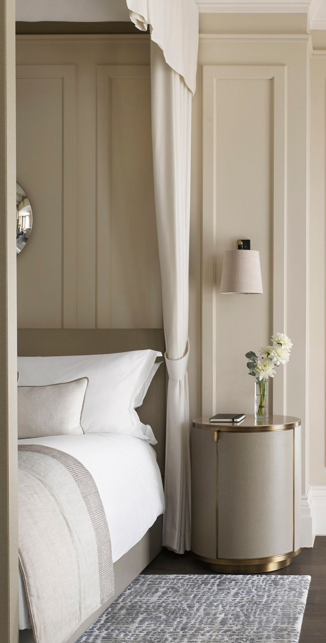 Elegant bedroom with canopy bed and neutral tones