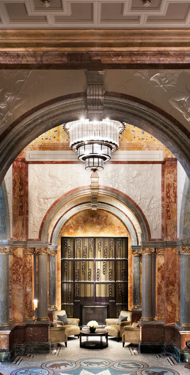 Elegant marble lobby with grand chandelier