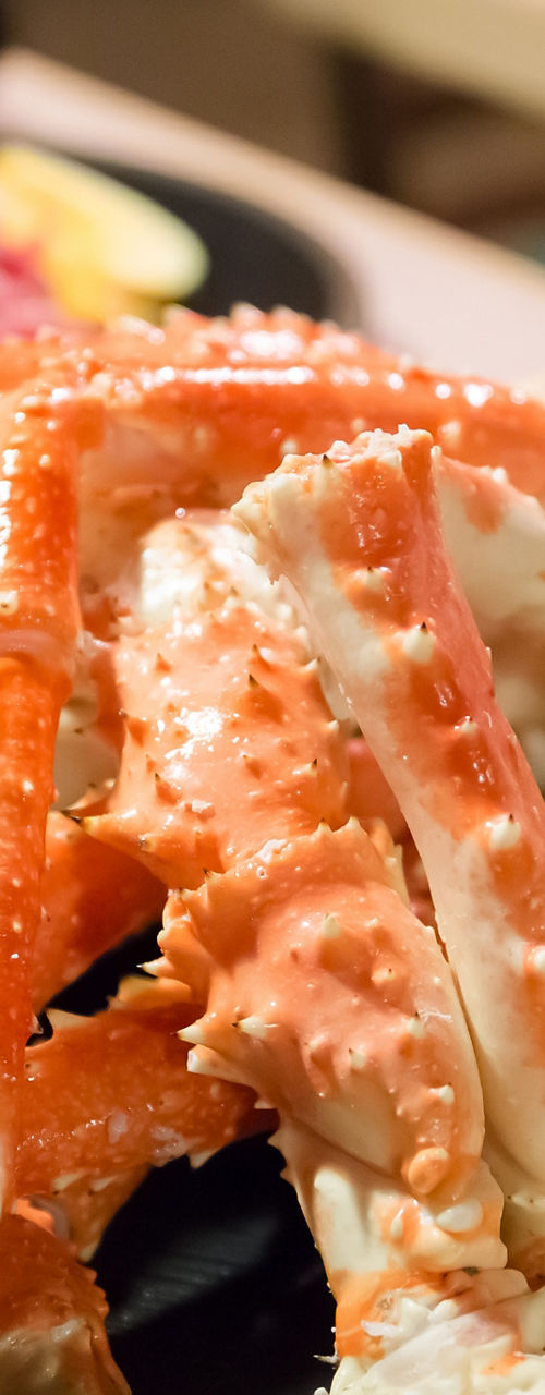 King crab legs with beer in dining setting
