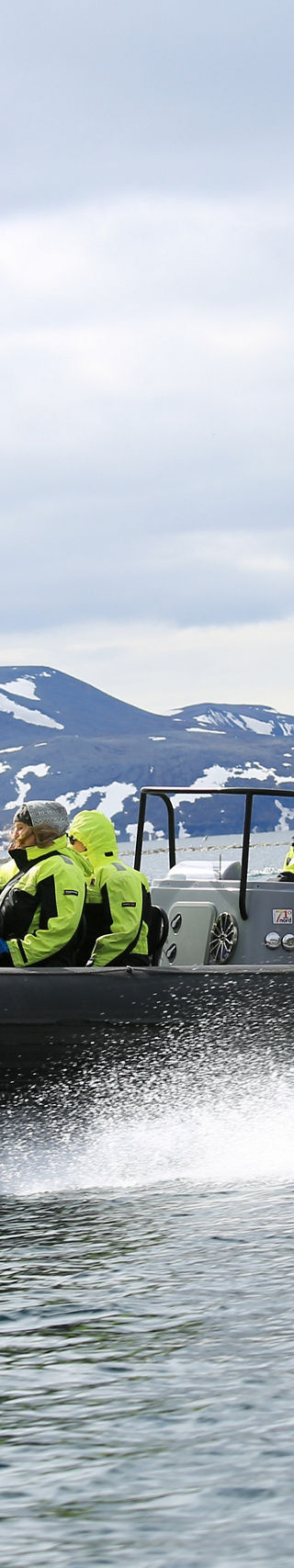 Group on speedboat in Arctic waters