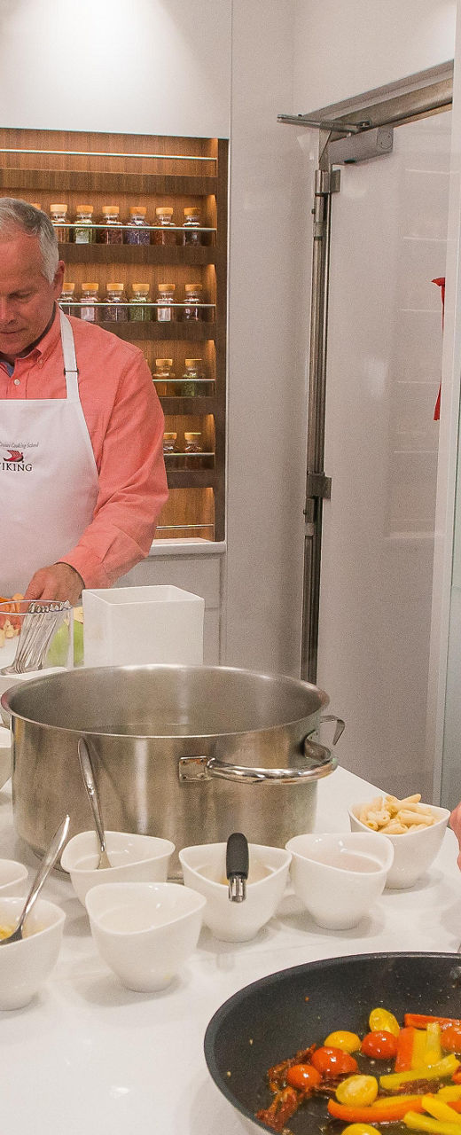 Cooking class with fresh vegetables and Viking aprons