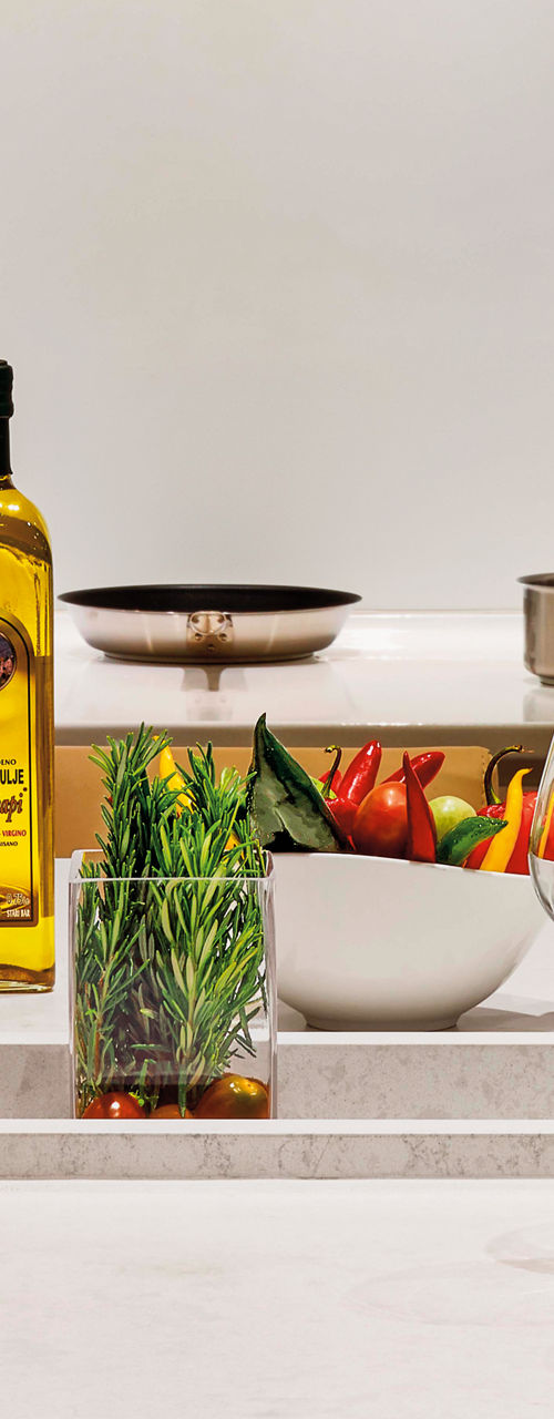 Modern kitchen with fresh ingredients and olive oil