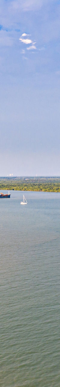 Scenic river view with distant ferry