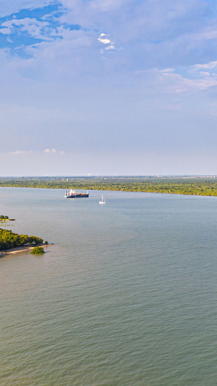 Scenic river view with distant ferry
