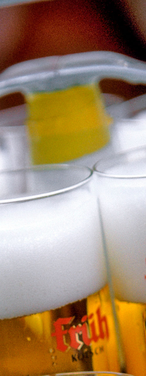 Tray of beer glasses with foam tops