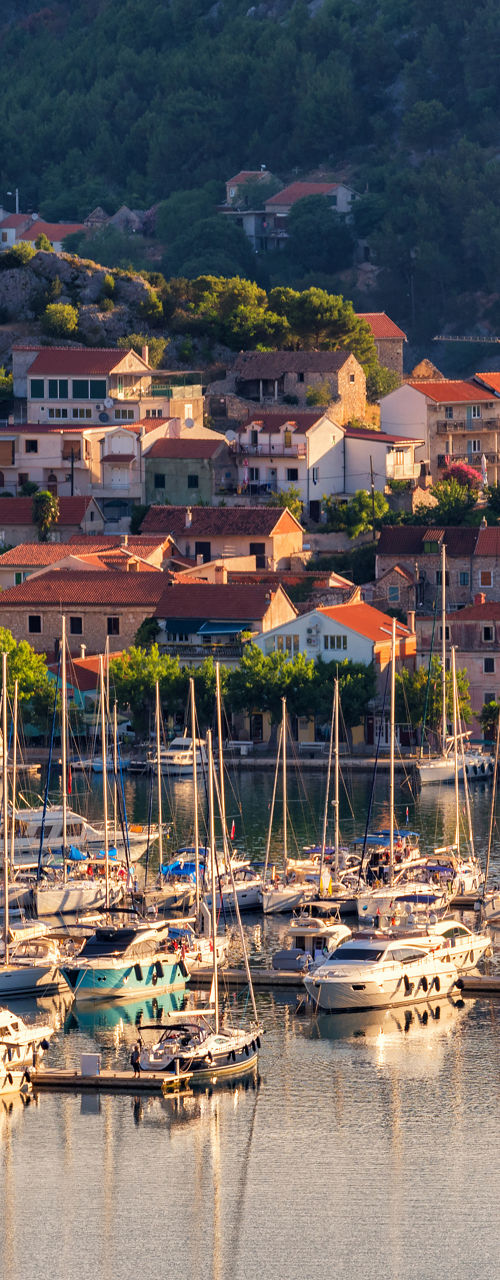 Scenic marina with sailboats at sunset