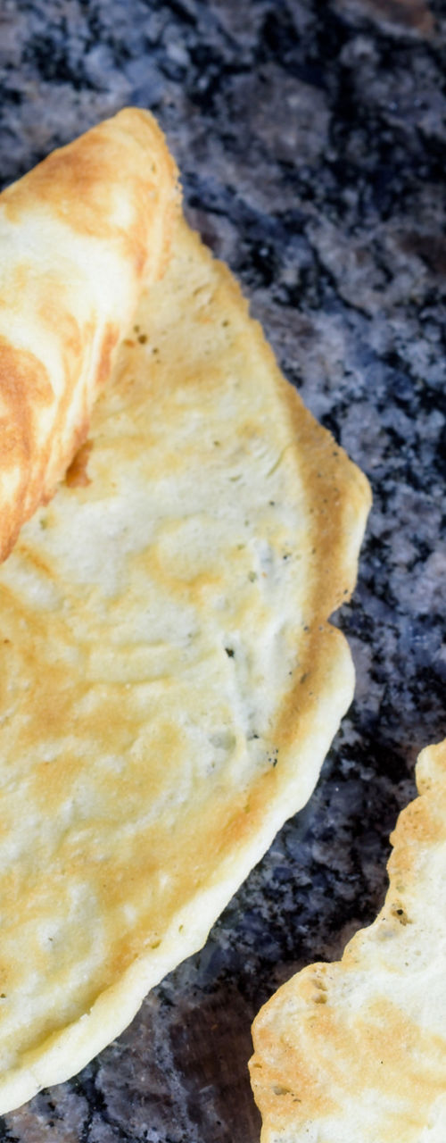 Thin golden crepes on granite surface