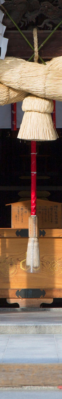 Traditional Japanese shrine entrance with sacred rope
