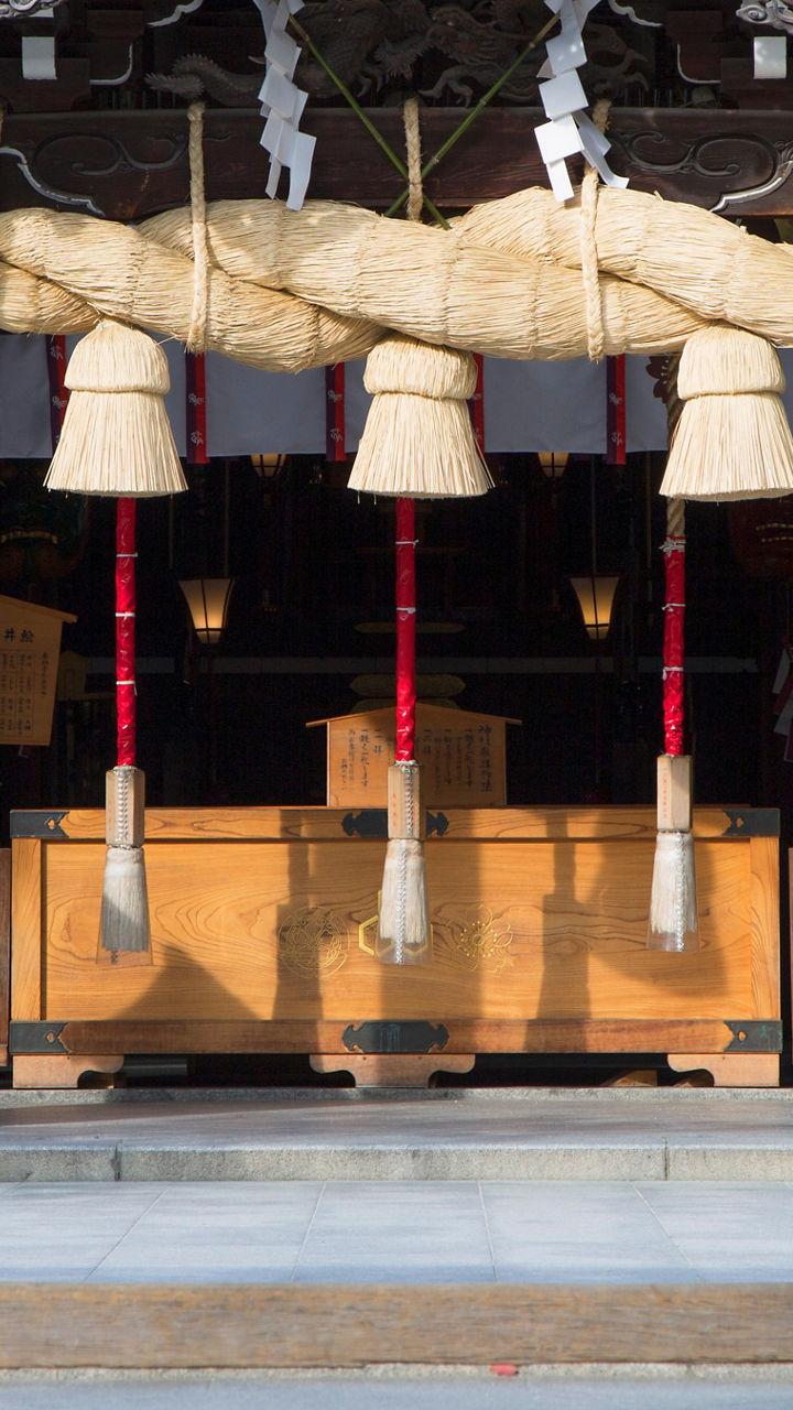 Traditional Japanese shrine entrance with sacred rope