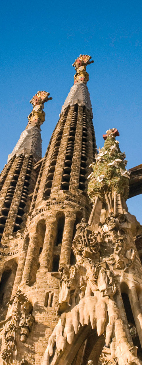 Sagrada Familia towers against blue sky