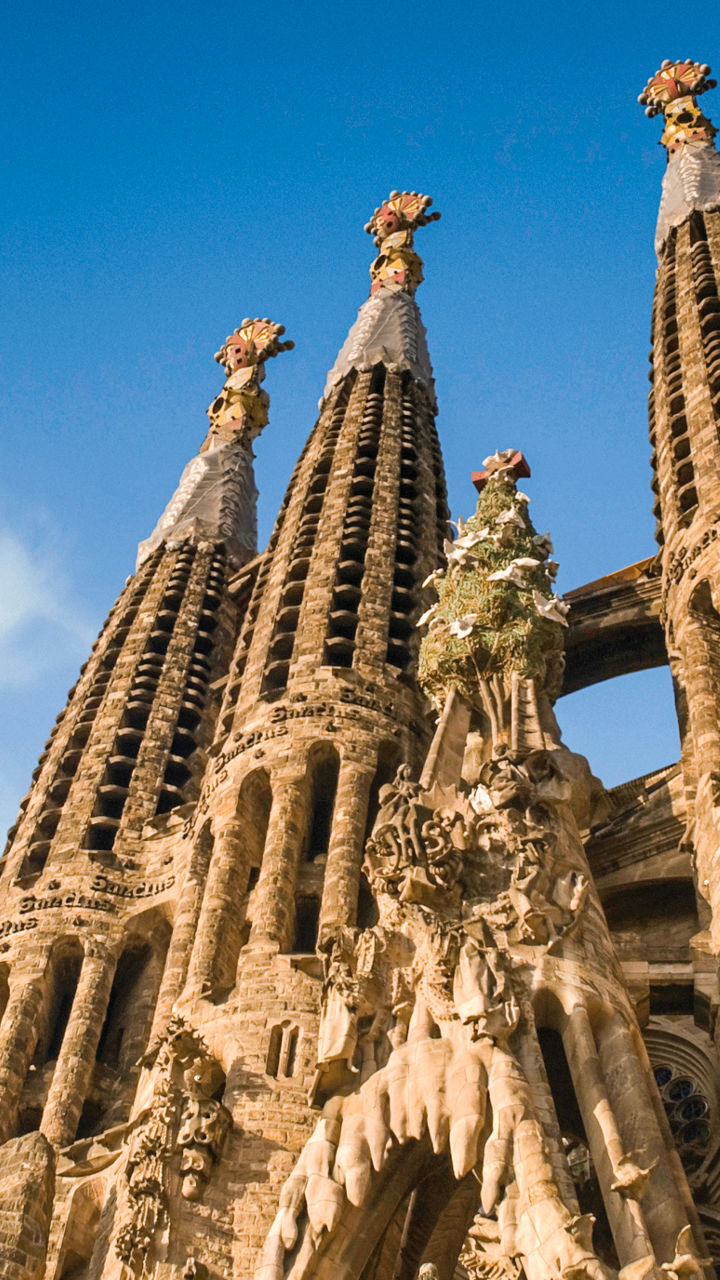 Sagrada Familia towers against blue sky