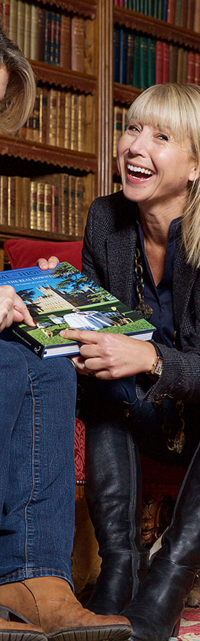 Two women in cozy library setting