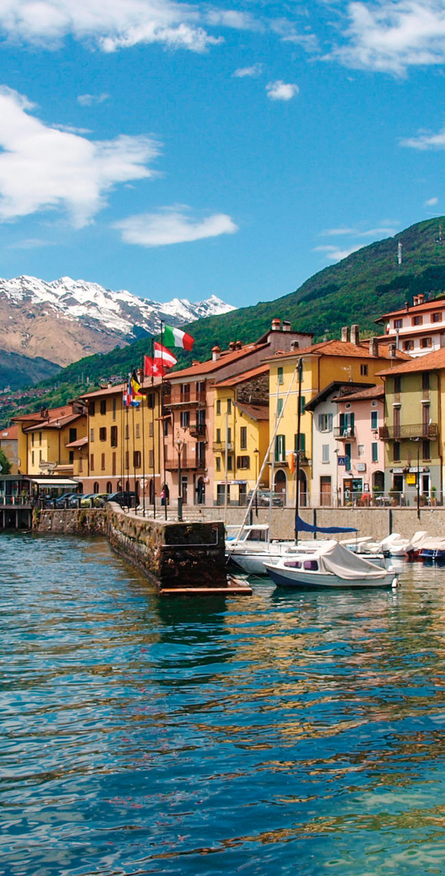 Colorful lakeside town with mountain backdrop