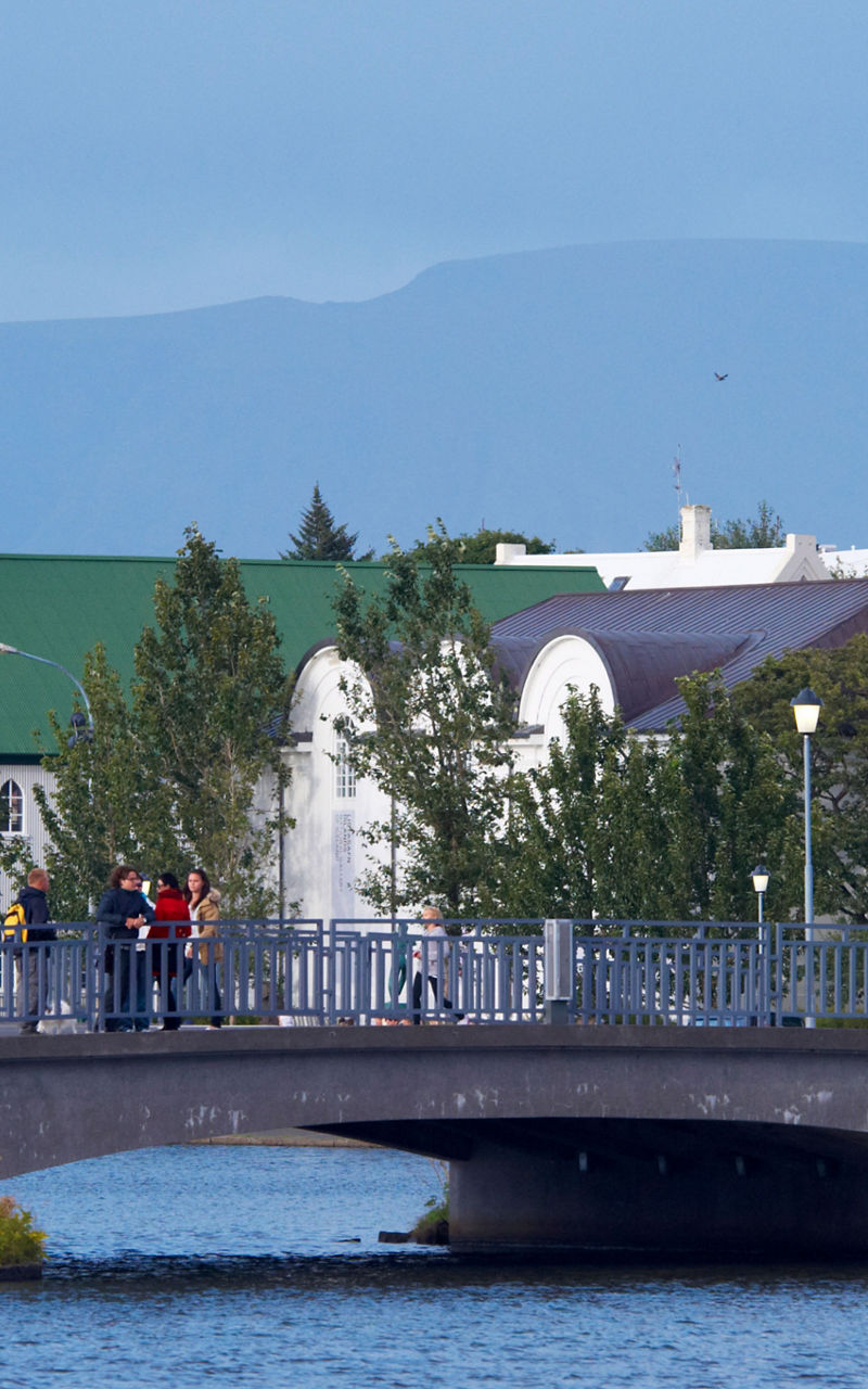 Scenic bridge with church and mountains