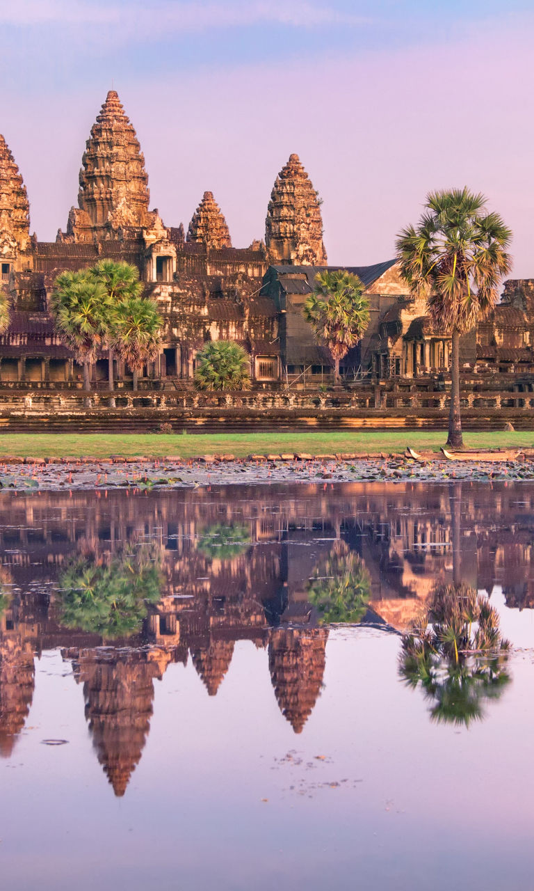 Angkor Wat temple at sunrise with reflection
