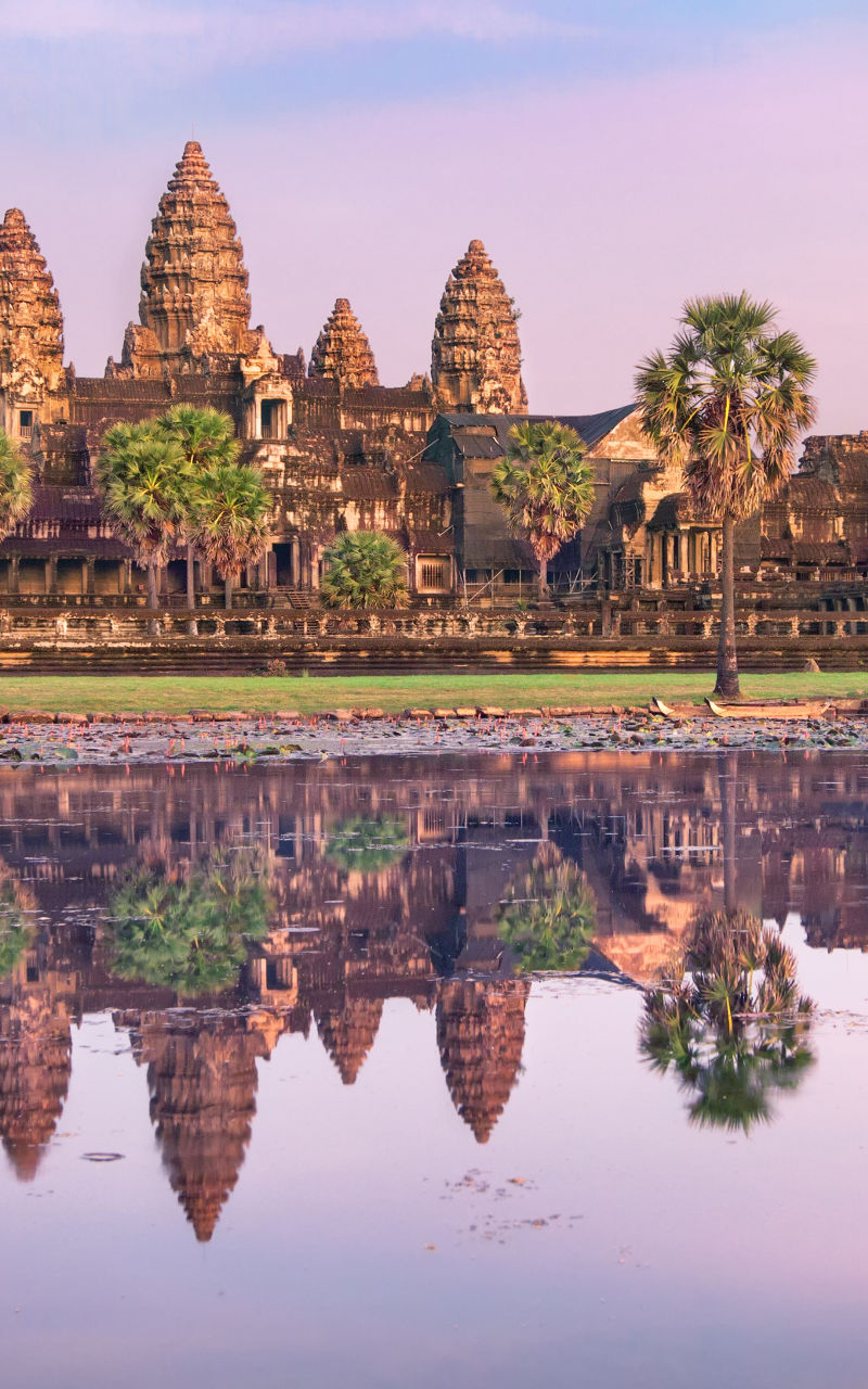Angkor Wat temple at sunrise with reflection