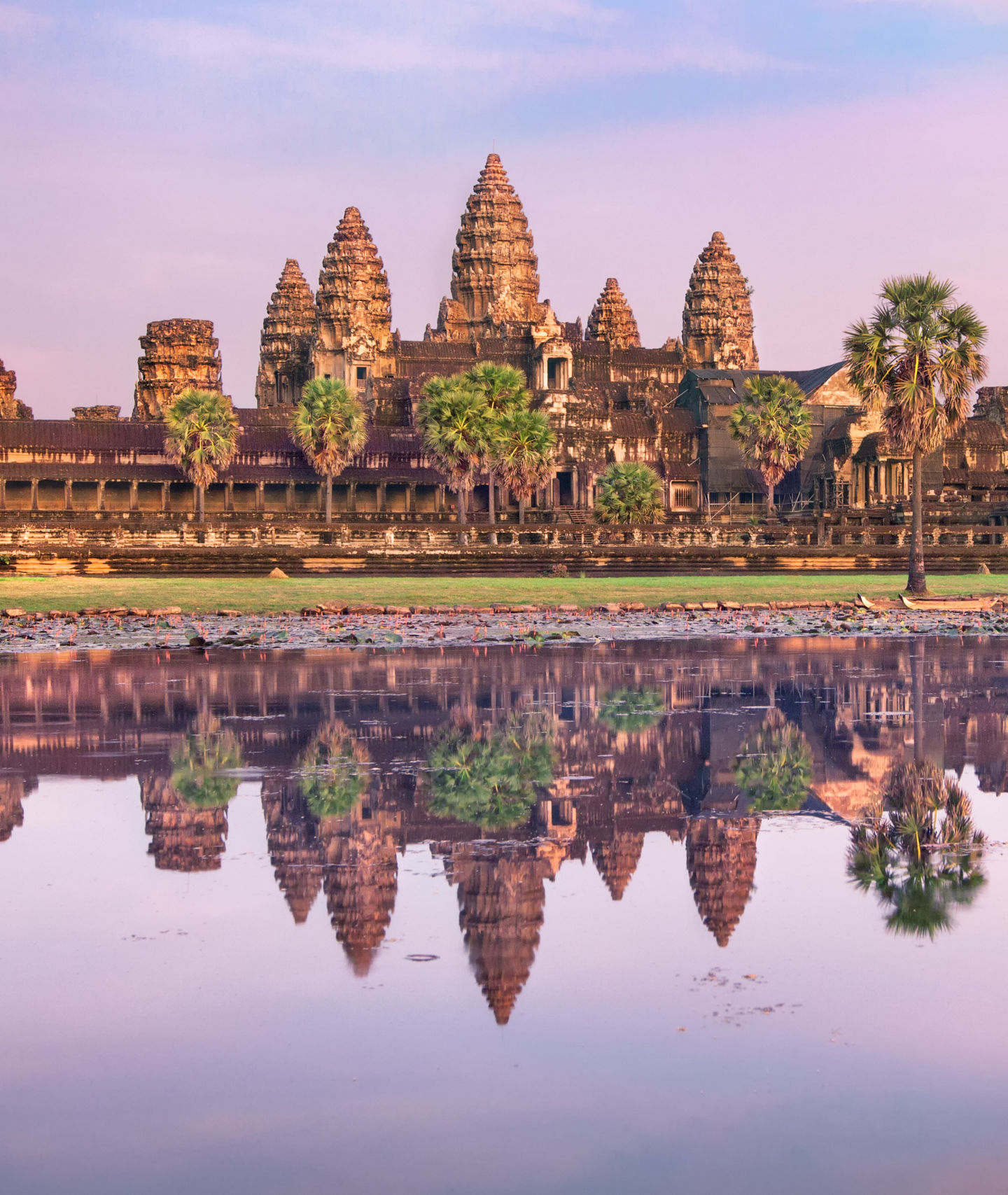 Angkor Wat temple at sunrise with reflection